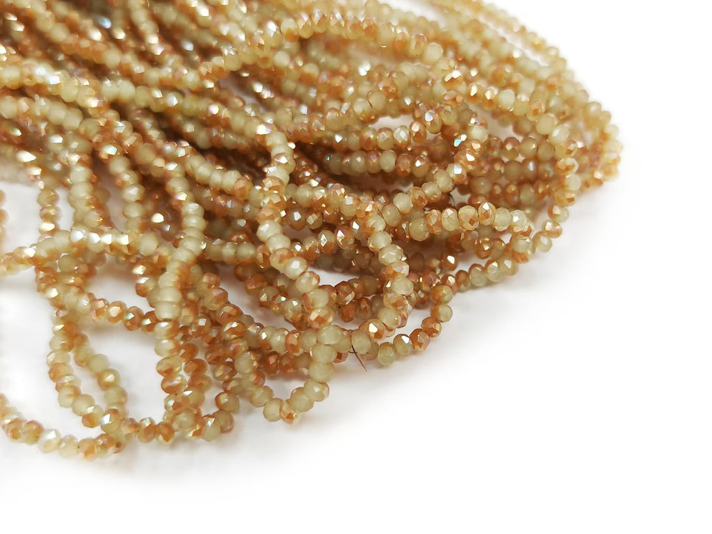Glass beads, 2x3mm faceted rondelle, light khaki with half coat Topaz color (#89) | 玻璃珠, 2x3mm, 切面扁珠, 半透淺米黃 X 半邊鍍琥珀金色 (#89)